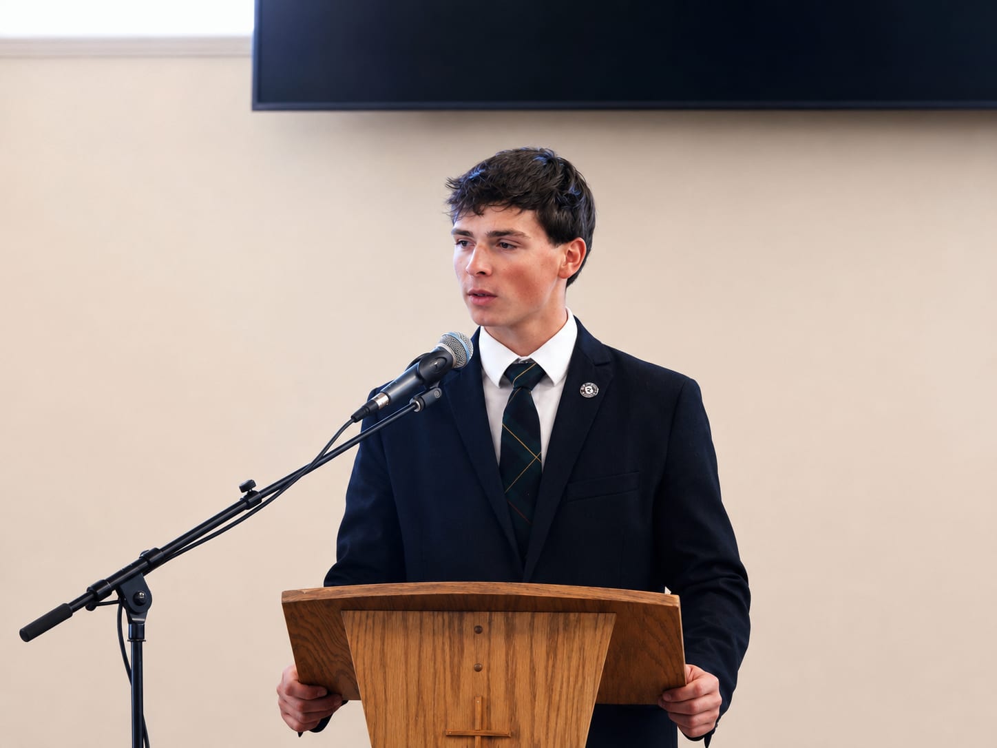 A Geneva Academy senior defending his thesis, the culmination of a classical Christian education in Roseburg, Oregon