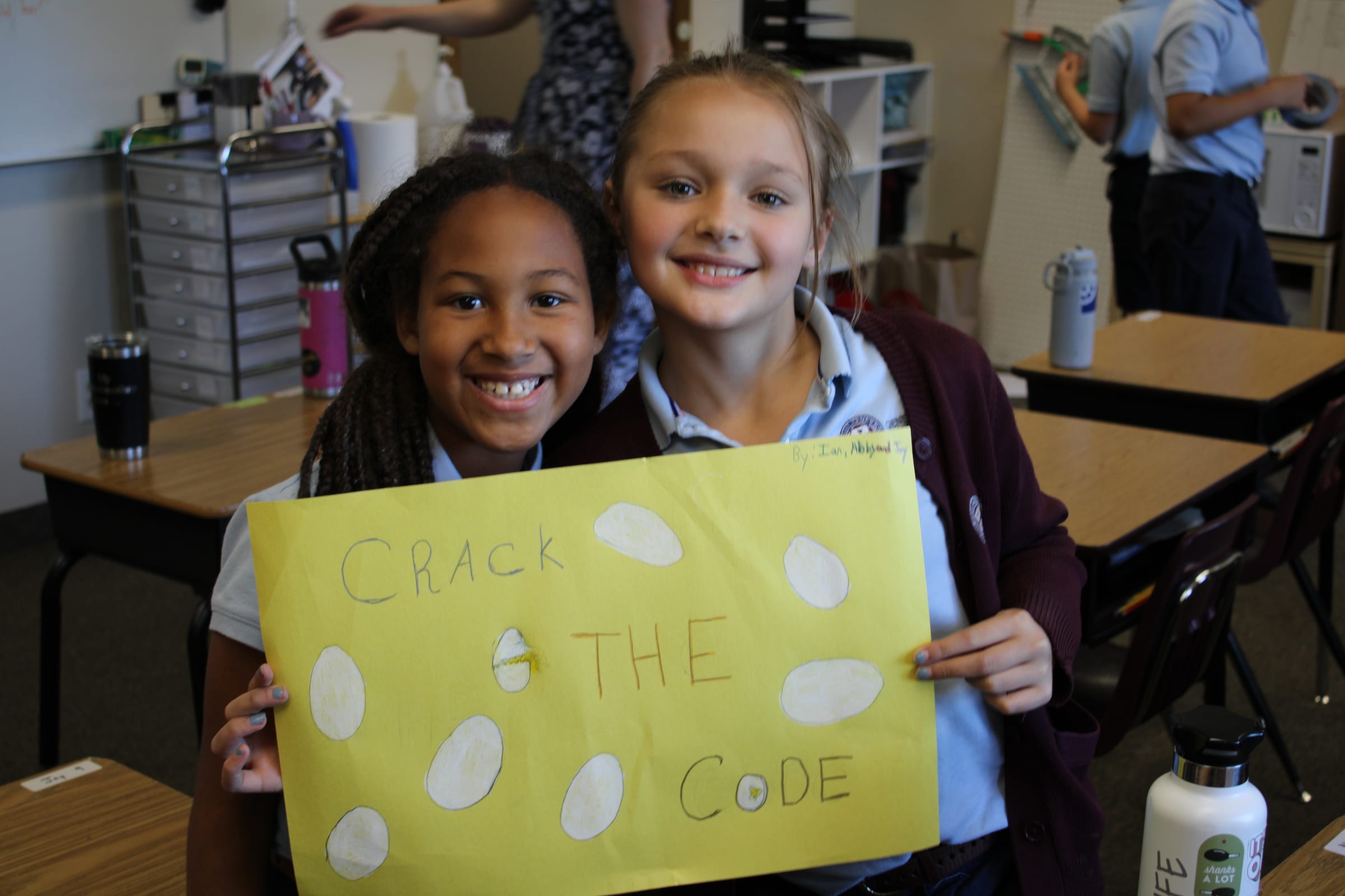 Geneva Academy students with a phonics project, learning to read