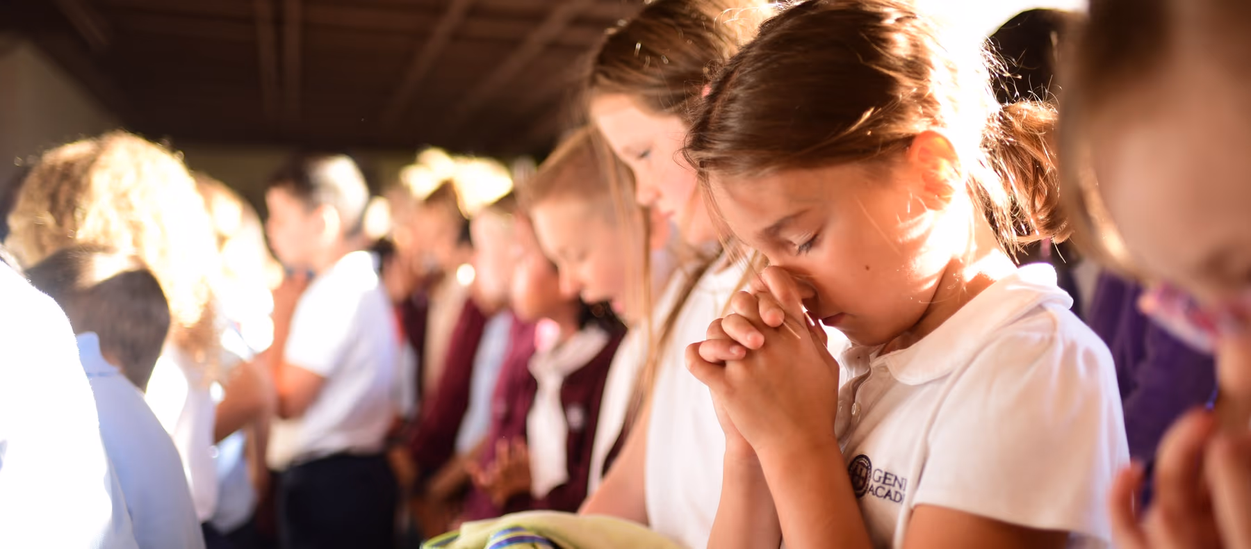 Geneva Academy students praying together at a classical Christian school in Roseburg, Oregon